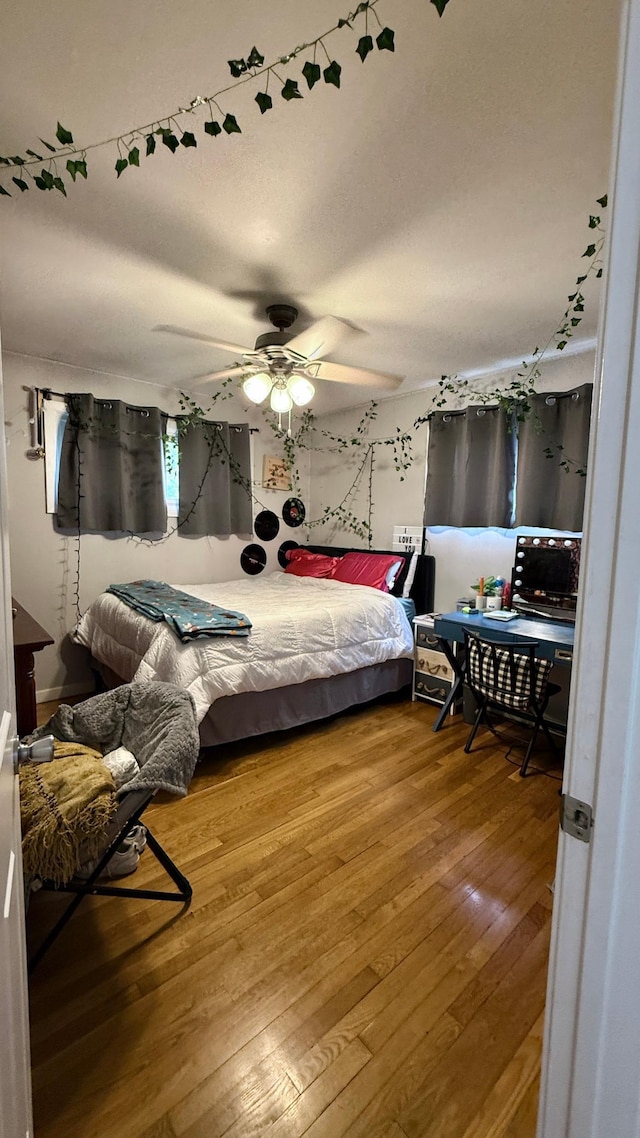 306 4th St, La Crescent, MN 55947 - bedroom featuring hardwood / wood-style floors and a ceiling fan