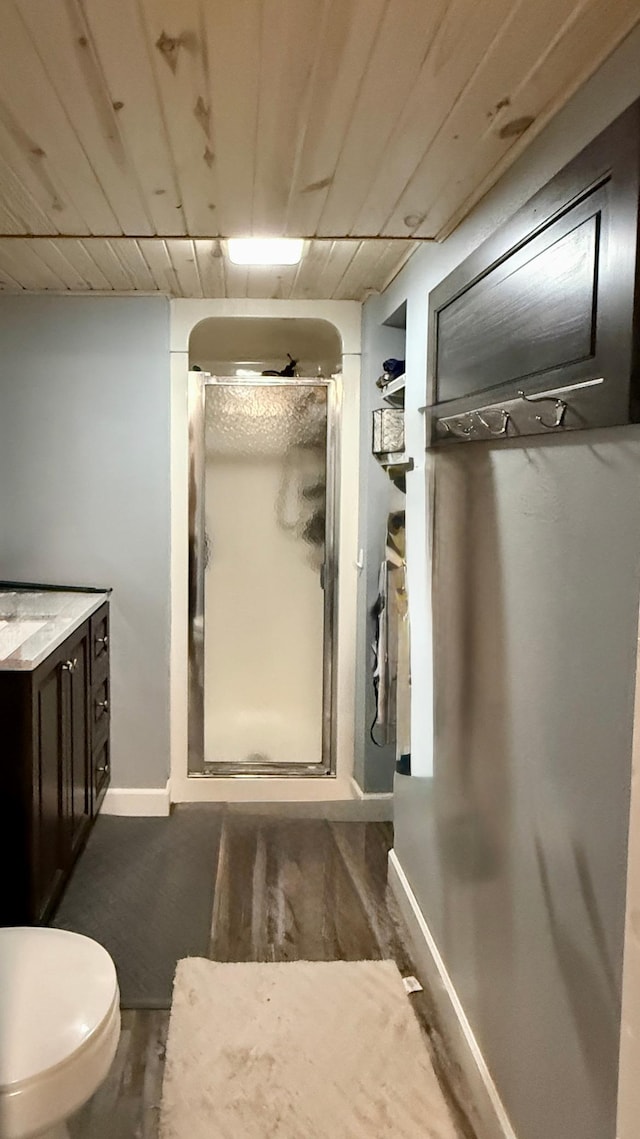 306 4th St, La Crescent, MN 55947 - full bath with a stall shower, vanity, and wood finished floors