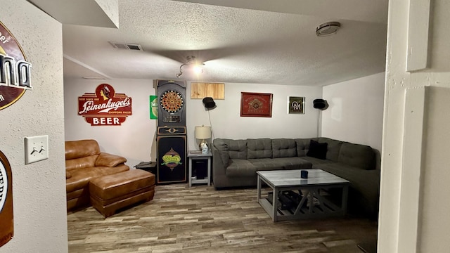 306 4th St, La Crescent, MN 55947 - living area with wood finished floors and a textured ceiling