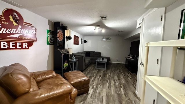 306 4th St, La Crescent, MN 55947 - living area with wood finished floors and a textured ceiling