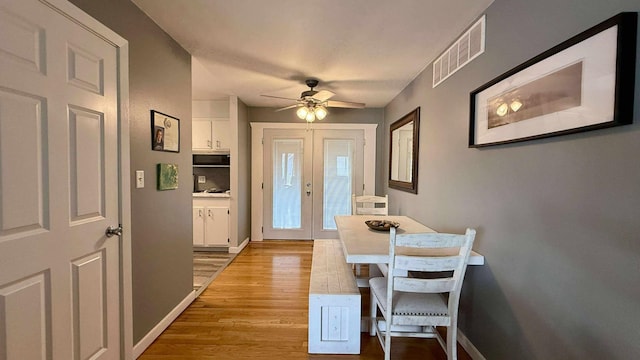 306 4th St, La Crescent, MN 55947 - entrance foyer with light wood-type flooring, a ceiling fan, and french doors