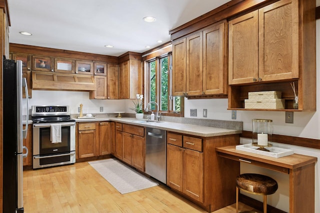 10301 Brunswick Cir, Bloomington, MN 55438 - kitchen with stainless steel appliances, custom exhaust hood, brown cabinets, light wood-style flooring, and recessed lighting
