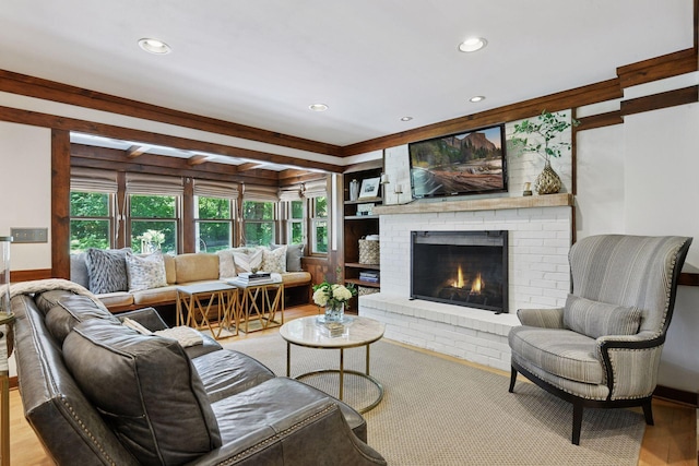 10301 Brunswick Cir, Bloomington, MN 55438 - living area with a brick fireplace, recessed lighting, and wood finished floors