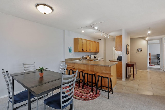 19 1st St Unit B2207, Minneapolis, MN 55401 - dining room featuring rail lighting and light tile patterned floors