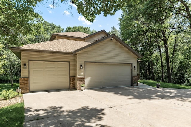 13756 Skyline Cir, Louisville Twp, MN 55379 - view of front of property with brick siding, concrete driveway, an attached garage, and a shingled roof