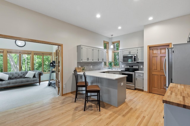 13756 Skyline Cir, Louisville Twp, MN 55379 - kitchen with appliances with stainless steel finishes, gray cabinets, tasteful backsplash, and recessed lighting