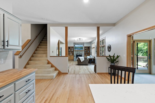 13756 Skyline Cir, Louisville Twp, MN 55379 - stairs with a fireplace and wood finished floors
