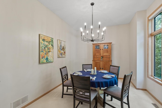 13756 Skyline Cir, Louisville Twp, MN 55379 - dining room featuring light carpet and a chandelier
