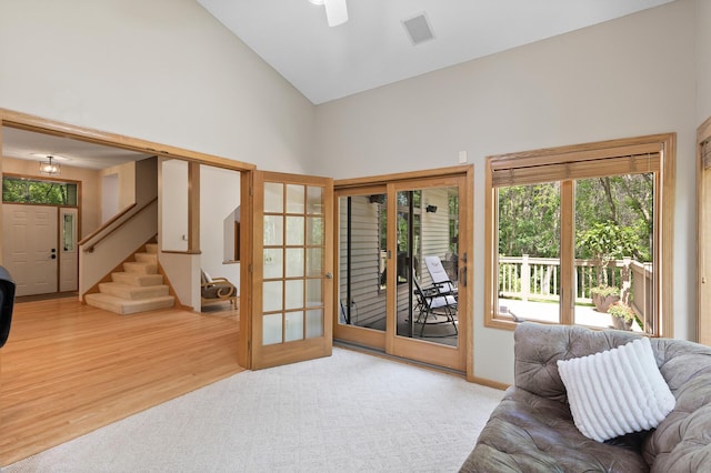 13756 Skyline Cir, Louisville Twp, MN 55379 - living room with stairway, high vaulted ceiling, wood finished floors, and ceiling fan