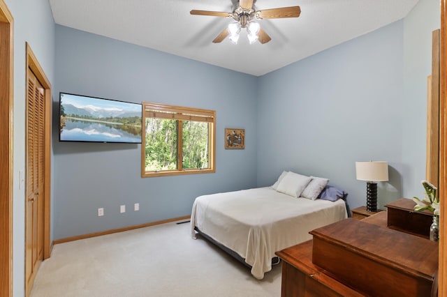 13756 Skyline Cir, Louisville Twp, MN 55379 - bedroom featuring light colored carpet, a ceiling fan, and a closet