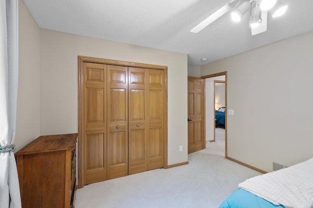13756 Skyline Cir, Louisville Twp, MN 55379 - bedroom featuring light colored carpet, ceiling fan, and a closet