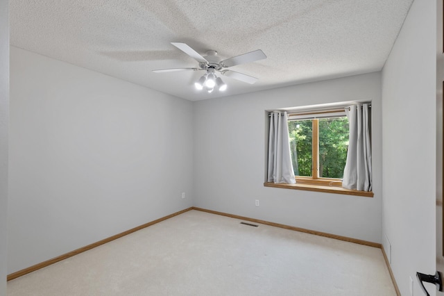 13756 Skyline Cir, Louisville Twp, MN 55379 - empty room with carpet floors, a ceiling fan, and a textured ceiling