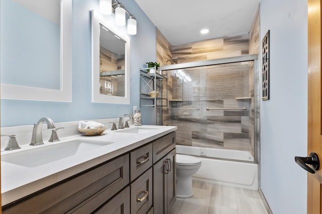 13756 Skyline Cir, Louisville Twp, MN 55379 - bathroom featuring double vanity, shower / bath combination with glass door, and recessed lighting