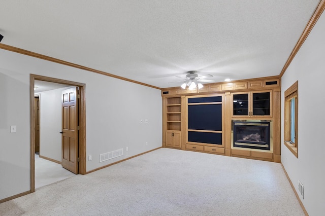 13756 Skyline Cir, Louisville Twp, MN 55379 - unfurnished living room with ornamental molding, light carpet, a ceiling fan, a textured ceiling, and built in features