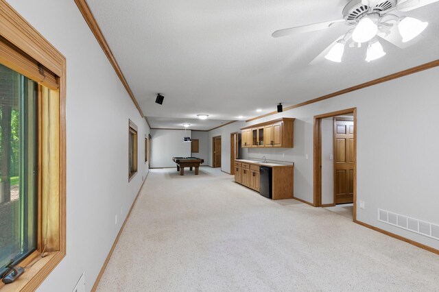 13756 Skyline Cir, Louisville Twp, MN 55379 - unfurnished living room with ornamental molding, light carpet, billiards, wet bar, and ceiling fan