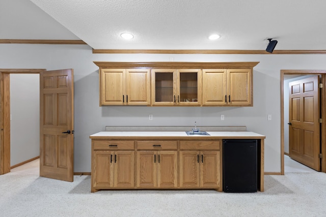 13756 Skyline Cir, Louisville Twp, MN 55379 - kitchen with light colored carpet, ornamental molding, fridge, glass insert cabinets, and light countertops