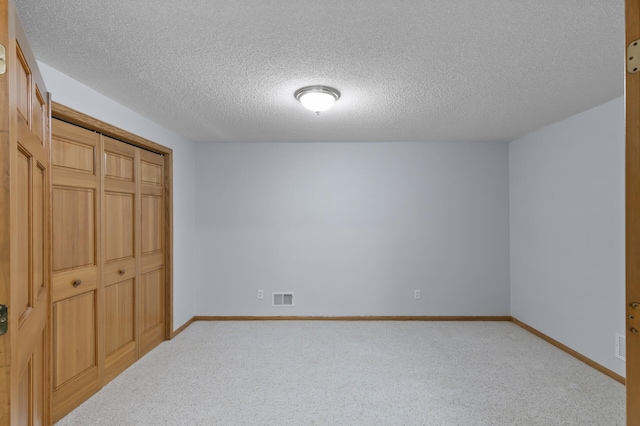 13756 Skyline Cir, Louisville Twp, MN 55379 - unfurnished bedroom with a textured ceiling, a closet, and carpet floors