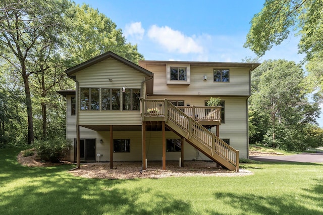 13756 Skyline Cir, Louisville Twp, MN 55379 - back of property with a lawn, a sunroom, stairs, and a deck