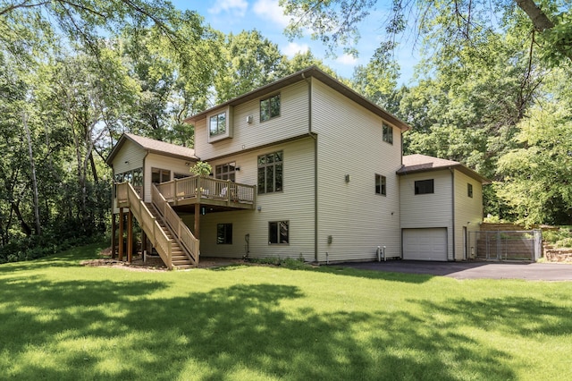 13756 Skyline Cir, Louisville Twp, MN 55379 - back of property featuring stairway, a wooden deck, driveway, a garage, and a lawn