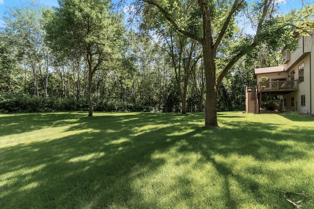 13756 Skyline Cir, Louisville Twp, MN 55379 - view of grassy yard with stairway and a wooden deck