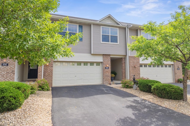 9769 Pinehurst Ct, Elko New Market, MN 55020 - multi unit property featuring asphalt driveway, a garage, and brick siding
