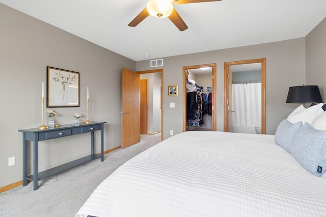 9769 Pinehurst Ct, Elko New Market, MN 55020 - bedroom with light carpet, a spacious closet, a ceiling fan, and a closet