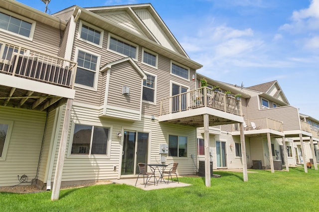 9769 Pinehurst Ct, Elko New Market, MN 55020 - rear view of house featuring a balcony, a lawn, and a patio area