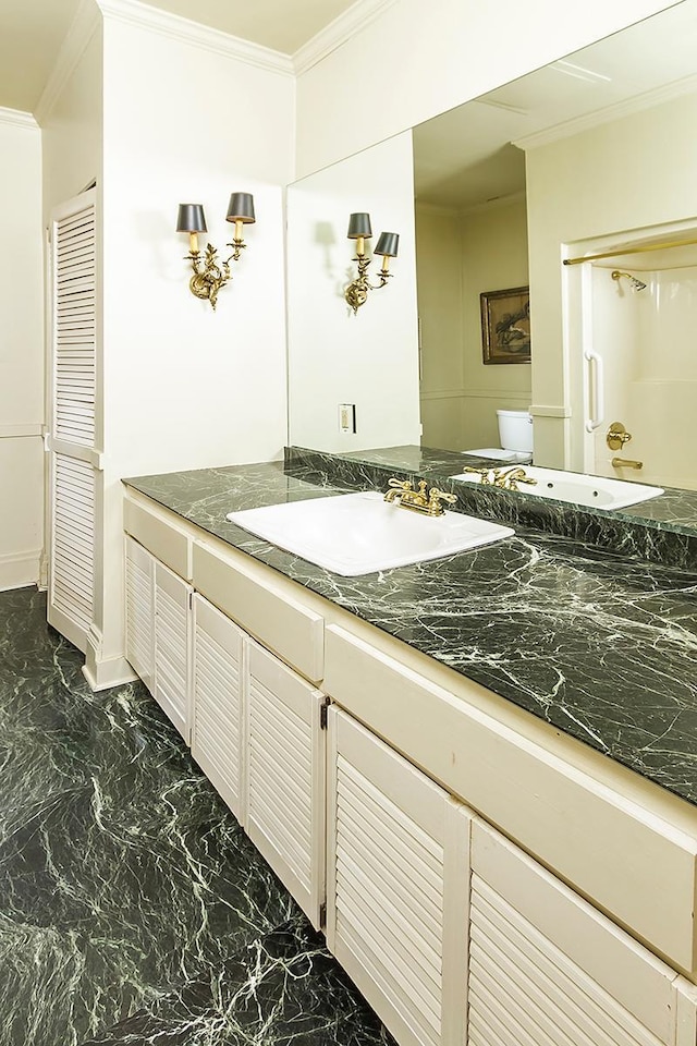 11 Summit Ct Unit 11, Saint Paul, MN 55102 - bathroom with ornamental molding, vanity, and marble finish floors
