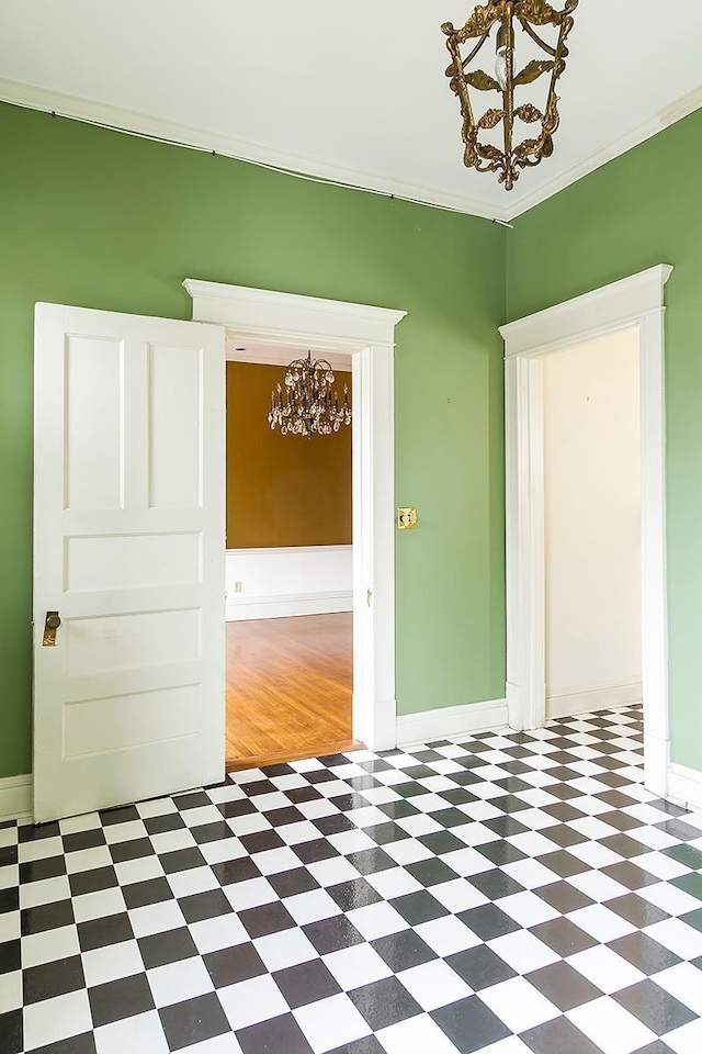 11 Summit Ct Unit 11, Saint Paul, MN 55102 - spare room with a chandelier, tile patterned floors, and crown molding