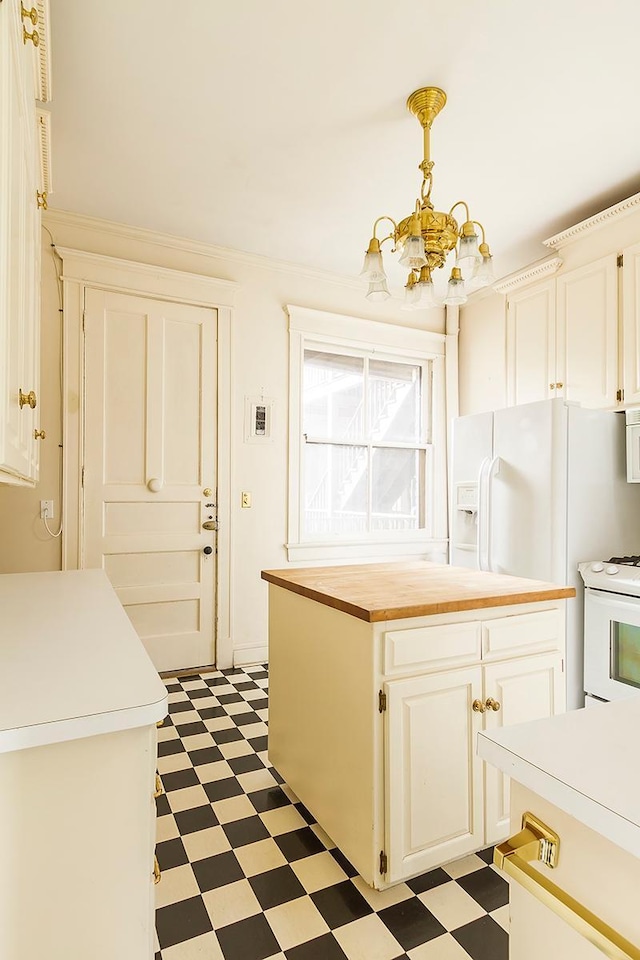 11 Summit Ct Unit 11, Saint Paul, MN 55102 - kitchen with light floors, a chandelier, butcher block countertops, white electric range oven, and white cabinets