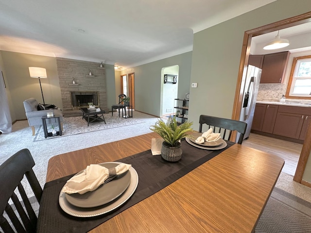 434 Rose Ave E, Saint Paul, MN 55130 - dining room with light carpet and a fireplace