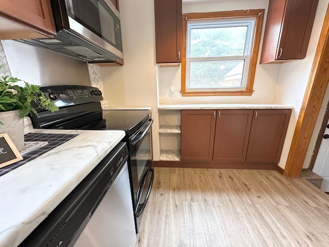 434 Rose Ave E, Saint Paul, MN 55130 - kitchen featuring black electric range, stainless steel microwave, light wood-style flooring, and dishwasher