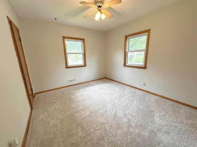 434 Rose Ave E, Saint Paul, MN 55130 - spare room with plenty of natural light, light carpet, and ceiling fan
