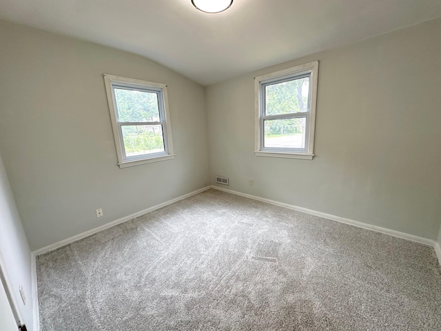 434 Rose Ave E, Saint Paul, MN 55130 - carpeted empty room with vaulted ceiling and baseboards