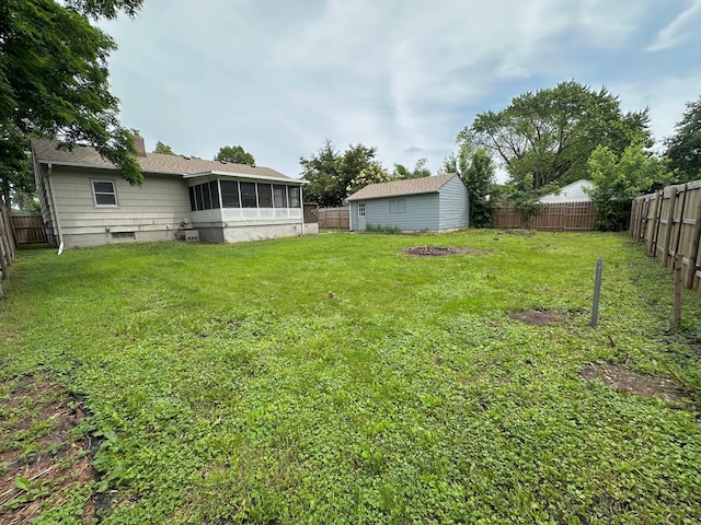 434 Rose Ave E, Saint Paul, MN 55130 - fenced backyard featuring a sunroom and an outdoor structure