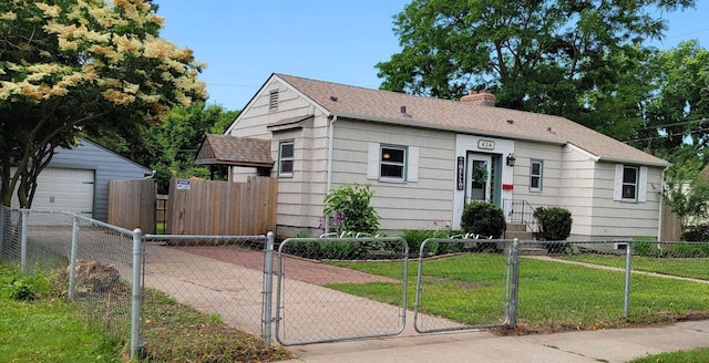 434 Rose Ave E, Saint Paul, MN 55130 - view of front of house featuring a chimney, a fenced front yard, a gate, concrete driveway, and a shingled roof