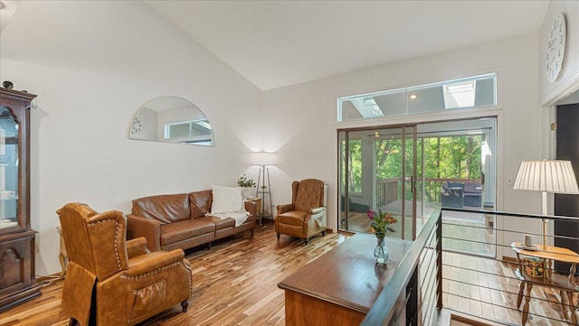 539 Deer Ridge Ln S, Maplewood, MN 55119 - living room with high vaulted ceiling and wood finished floors