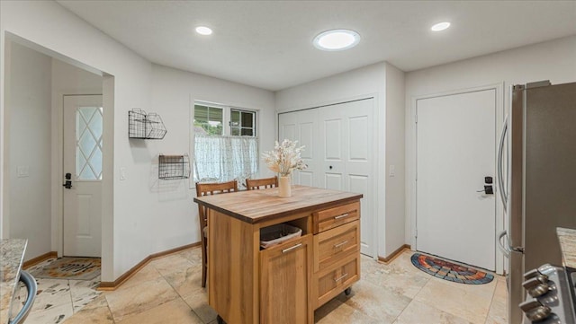 539 Deer Ridge Ln S, Maplewood, MN 55119 - kitchen featuring freestanding refrigerator, butcher block countertops, and recessed lighting