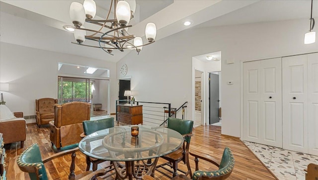 539 Deer Ridge Ln S, Maplewood, MN 55119 - dining space with a chandelier, light wood-type flooring, lofted ceiling, and recessed lighting