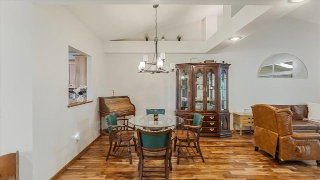 539 Deer Ridge Ln S, Maplewood, MN 55119 - dining room featuring lofted ceiling, a chandelier, and wood finished floors