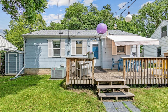 6916 Russell Ave S, Richfield, MN 55423 - back of property with a shed, a lawn, a deck, and a shingled roof