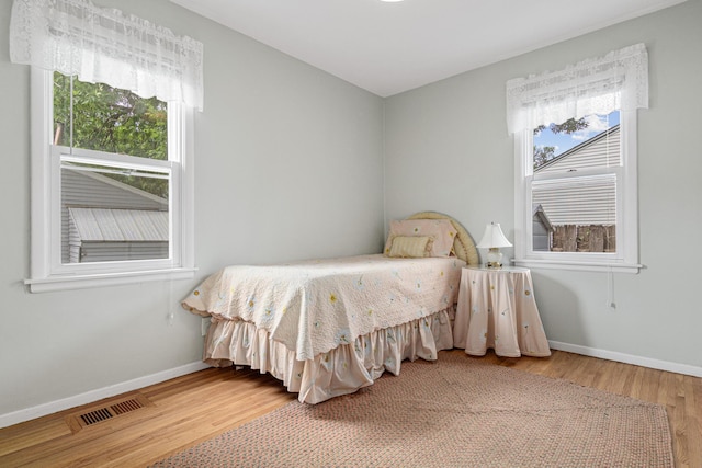 6916 Russell Ave S, Richfield, MN 55423 - bedroom with wood finished floors and baseboards