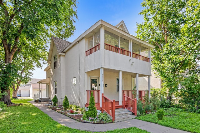 2414 3rd St NE, Minneapolis, MN 55418 - view of front of property with a front yard, covered porch, roof with shingles, and stucco siding