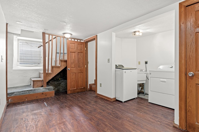 2414 3rd St NE, Minneapolis, MN 55418 - laundry area with wood finished floors, a textured ceiling, and washing machine and dryer