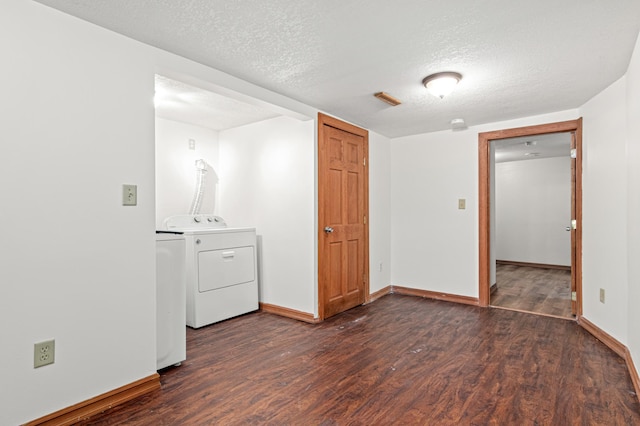 2414 3rd St NE, Minneapolis, MN 55418 - empty room with wood finished floors, a textured ceiling, and washing machine and clothes dryer