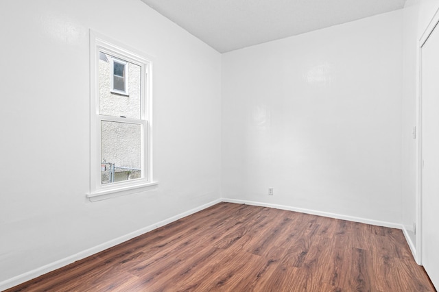 2414 3rd St NE, Minneapolis, MN 55418 - empty room with dark wood finished floors and plenty of natural light
