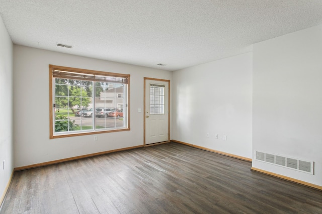 12100 Killdeer St NW Unit 512Nw, Coon Rapids, MN 55448 - spare room with wood finished floors and a textured ceiling