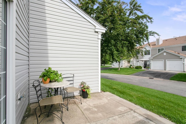 12100 Killdeer St NW Unit 512Nw, Coon Rapids, MN 55448 - view of patio featuring a residential view