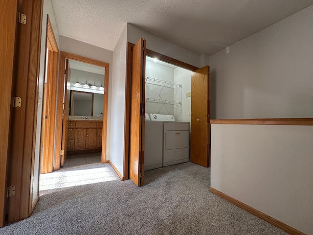 12100 Killdeer St NW Unit 512Nw, Coon Rapids, MN 55448 - hallway with washer and dryer and carpet flooring