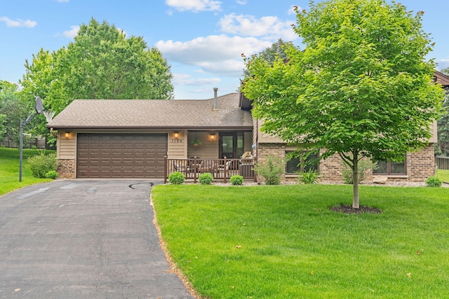 1104 Lavon Ln, Burnsville, MN 55306 - view of front of home featuring brick siding, an attached garage, driveway, and a front lawn